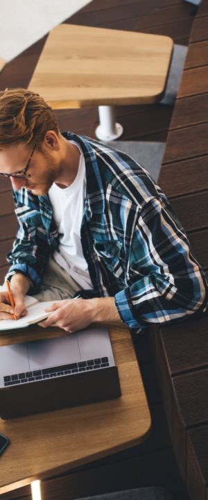 Guy working or studying in coworking office space